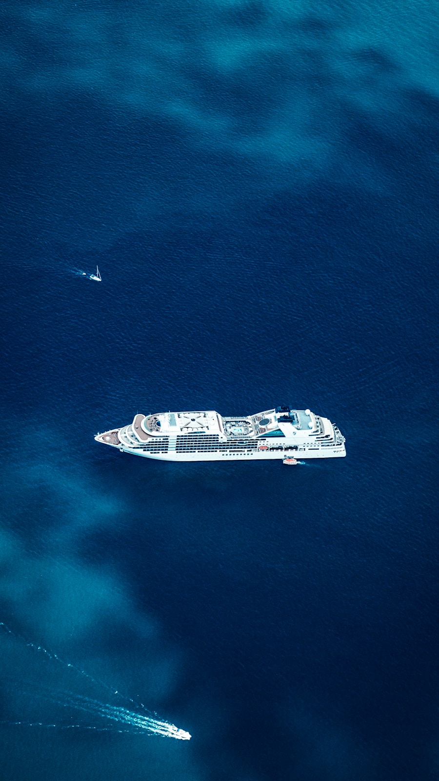 Aerial view of a cruise ship in deep blue water